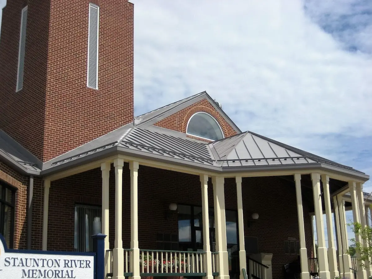 Skilled roofing craftsmen working on a residential roof in Natchitoches